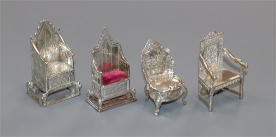 Four early 20th century miniature silver/white metal chairs, one a pincushion, one modelled as the Coronation Chair